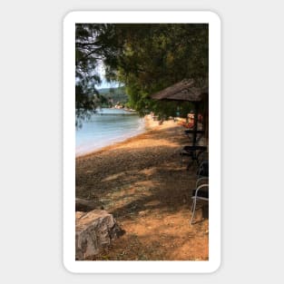 Scenic view on Mediterranean sea from beach cafe under fir trees and tiki bar Sticker